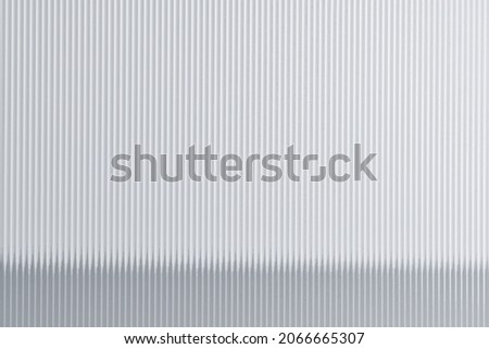 Glass background with reeded pattern