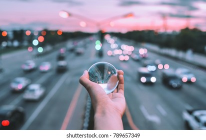 Glass Ball In Hand With Travel.