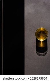 Glass of bear, top view, dramatic light, long defined shadow, lot of copyspace