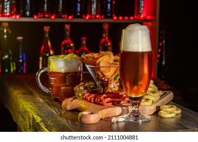 Glass Of Beer On Bar Counter, Charcuterie Plate Board, Meat, Boiled Pork, Smoked Meats, Prosciutto. Jugs, Mugs, Pints Of Beverage, Ale, Cider, Snack On Wooden Table In Pub, Bar In Vintage Brewery.