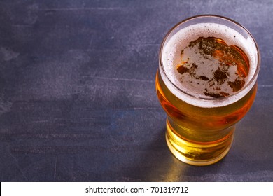 Glass Of Beer On Gray Background. Ale. View From Above, Top Shot