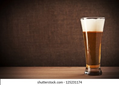 Glass With Beer On The Table