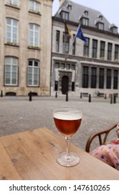 Glass Of Beer On Table In Street Restaurant, Antwerpen, Belgium 