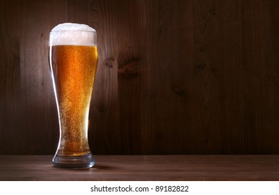 Glass Beer On Wood Background With Copyspace