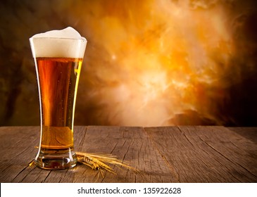 Glass Of Beer On Wooden Table