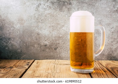 Glass Of Beer On Wooden Table. Wallpaper With Copy Space