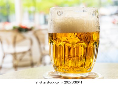 Glass Of Beer Outdoor, Cold Light Beer On The Wooden Table. 