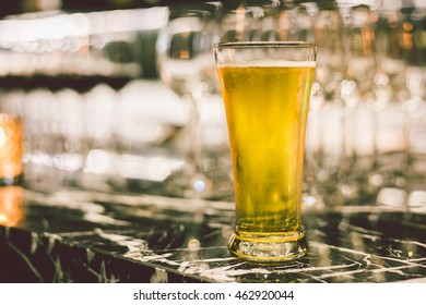 Glass of beers on table