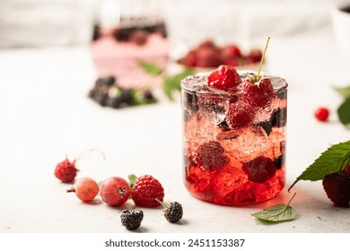 Glass of berry cocktail or drink soda with fresh berries on white background - Powered by Shutterstock