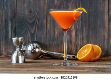 Glass Of Blood And Sand Cocktail In Martini Glass Garnished With Orange Peel