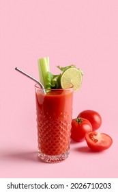 Glass of bloody mary cocktail and tomatoes on color background