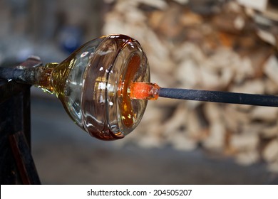 glass blower carefully making his product