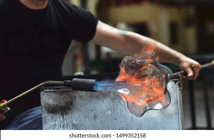 Glass Blowing Art And Flame.
Handmade Glassware Is Produced On High Fire.