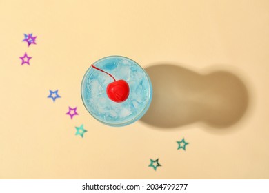 Glass of Blue Lagoon cocktail on color background - Powered by Shutterstock