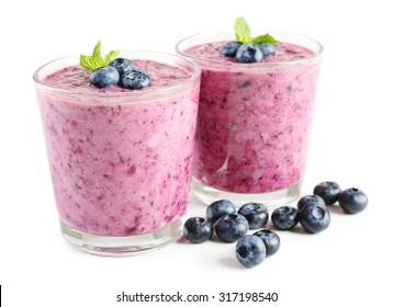 Glass Of Blueberry Smoothie Isolated On White