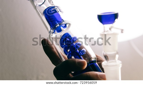 glass bongs for smoking weed close-up soft\
focus. smoking accessories weed buds\
pot