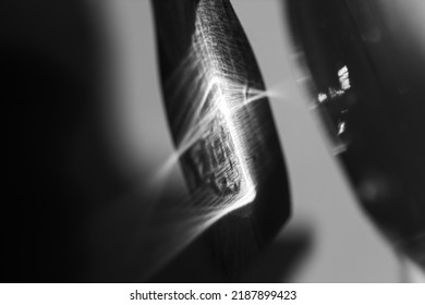 Glass bottle cast beautiful shadow and caustic effect as light passes through a glass. Black and white photo. Abstract background - Shutterstock ID 2187899423
