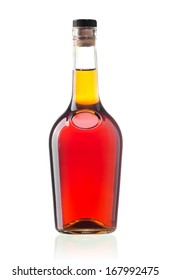 The glass bottle of cognac isolated on white