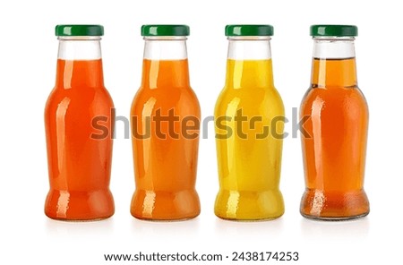 Glass bottle of  juice with green lid isolated on white 