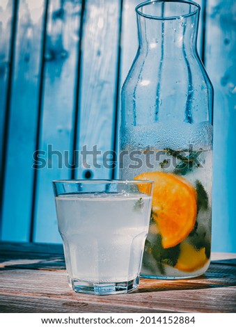 Similar – Infused fruit water cocktails and woman drinking green smoothie