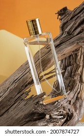 Glass Bottle Of Perfume On A Driftwood, Natural Shade Background, Perfume With Woody Notes