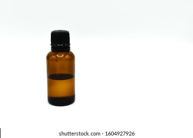 Glass Bottle Of Tea Tree Oil Isolated On White Background