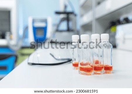 Glass bottles with orange solution use for test Coliform in water and ice. Water quality test in laboratory.
