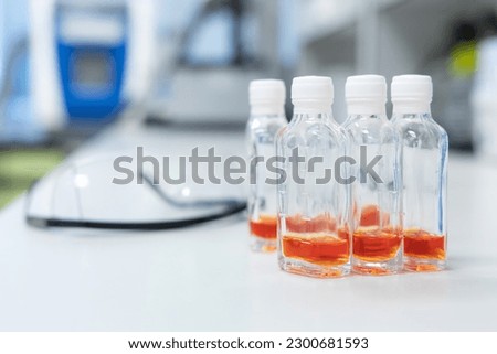 Glass bottles with orange solution use for test Coliform in water and ice. Water quality test in laboratory.