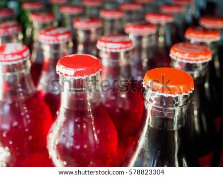 glass bottles with soft drinks background
