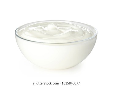 Glass bowl with creamy yogurt on white background