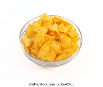 A Glass Bowl Filled With Potato Chips In Front Of White Background