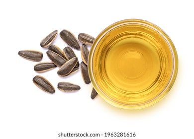 Glass Bowl Of Sunflower Seed Oil And Fresh Organic Sun Flower Seeds Isolated On White Background. Top View. Flat Lay.