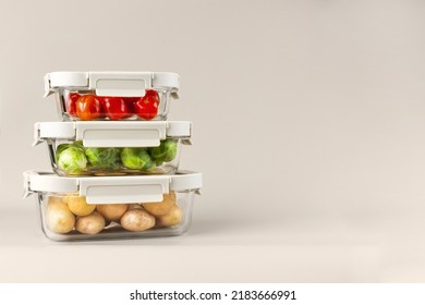 Glass boxes with fresh raw vegetables.  Vegetables and fruits in glass containers. Food storage concept - Powered by Shutterstock