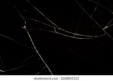 glass broken into a large number of pieces and cracks, a piece of glass with a large number of cracks and broken parts - Shutterstock ID 2268055121