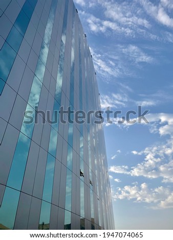Glass building and a cloudy day