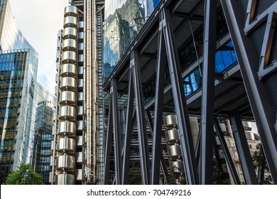 Glass Building With Reflection Of Blue Sky In Lloyds Of London Insurance Market