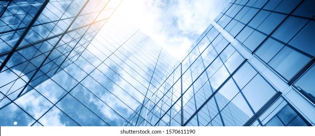 glass buildings and cloudy blue sky background