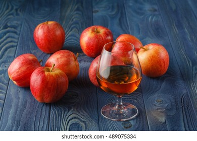 Glass Of Calvados Brandy And Red Apples