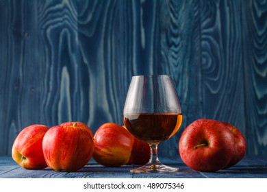 Glass Of Calvados Brandy And Red Apples