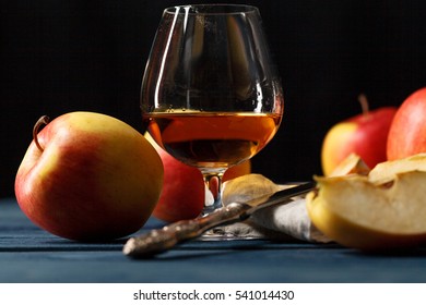 Glass Of Calvados Brandy And Red Apples