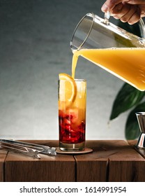 A Glass Of Campari And Orange Juice Pouring