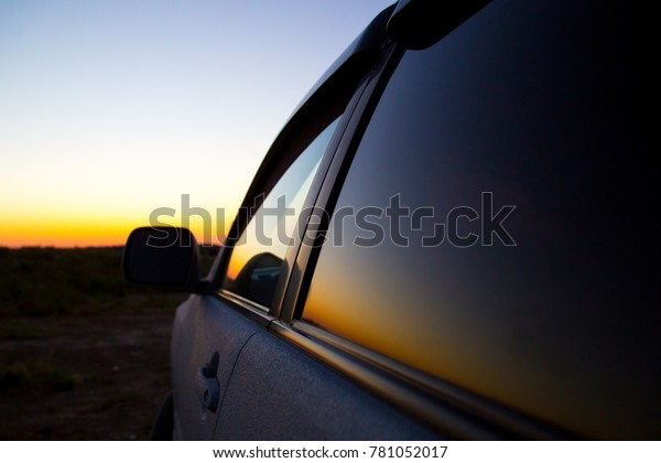 Glass from the car in the\
sun at dawn