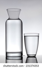 Glass And A Carafe Filled With Water