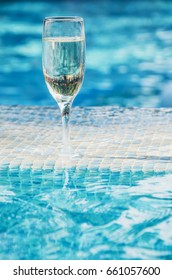 A Glass Of Champagne In The Pool