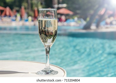 Glass Of Champagne In The Pool