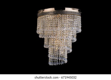 glass chandelier isolated over black background