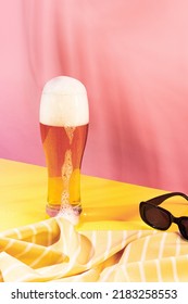 Glass Of Chill Foamy Lager Beer Isolated Over Pink Yellow Background. Summer Pool Party. Vacation. Concept Of Cocktails, Alcoholic Drinks, Taste, Party, Mix. Copy Space For Ad. Retro Style