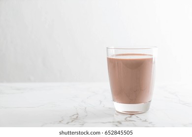 Glass Of Chocolate Milk On The Table