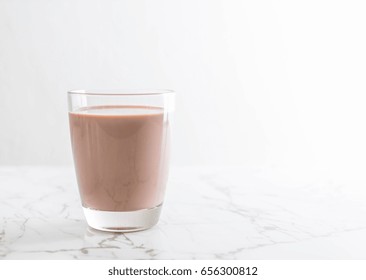 Glass Of Chocolate Milk On The Table