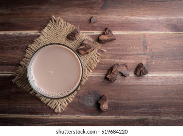 Glass Of Chocolate Milk On Wood Table,top View